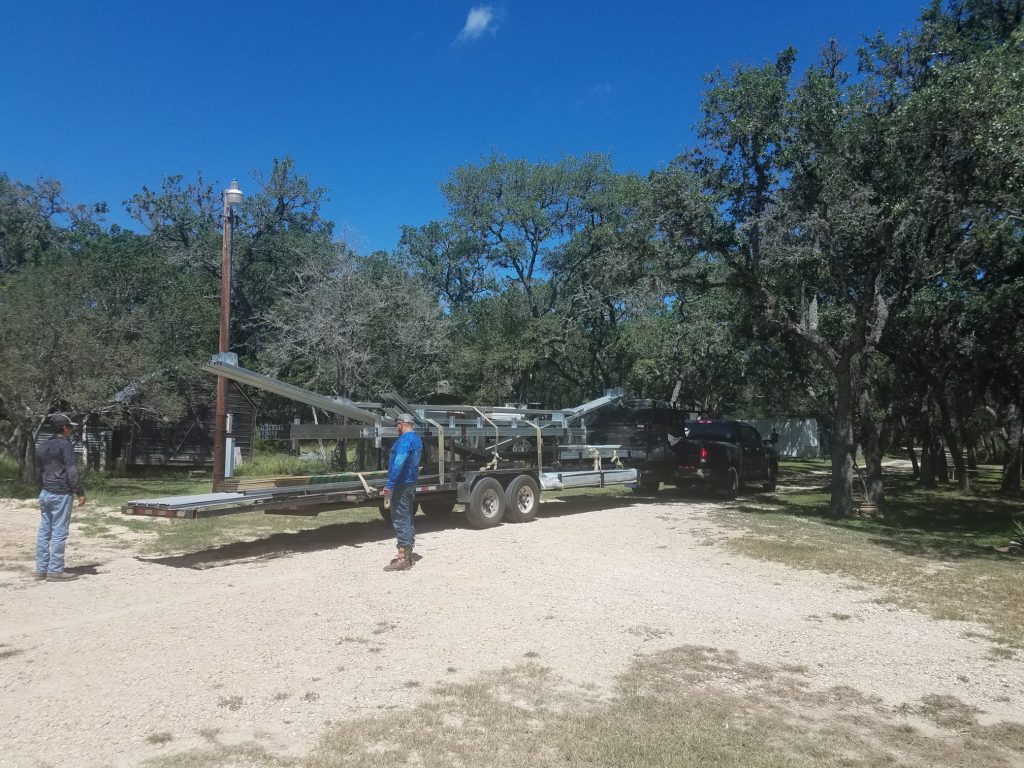 Building crew and materials show up to erect the building.