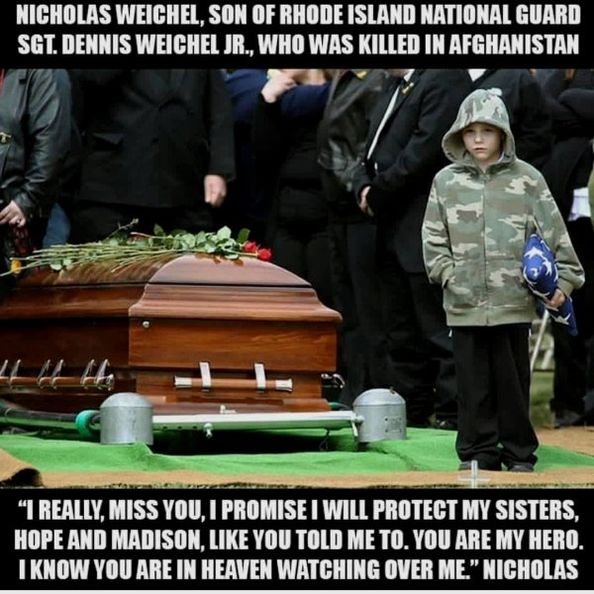 A warrior's son at the funeral of his father.

Nicholas Weichel, son of Rhode Island National Guard Sgt. Dennis Weichel, Jr., who was killed in Afghanistan.

"I really, miss you, I promise I will protect my sisters, Hope and Madison, like yu told me to.  You are my hero.  I know you are in heaven watching over me." -- Nicholas